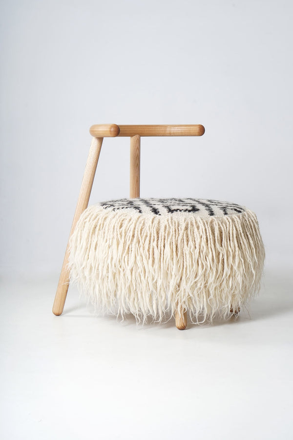 Close-up of black-and-white patterned armchair – artisanal design by Mapico