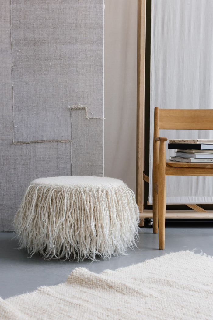 Handcrafted Mapico Pouf in a contemporary living room