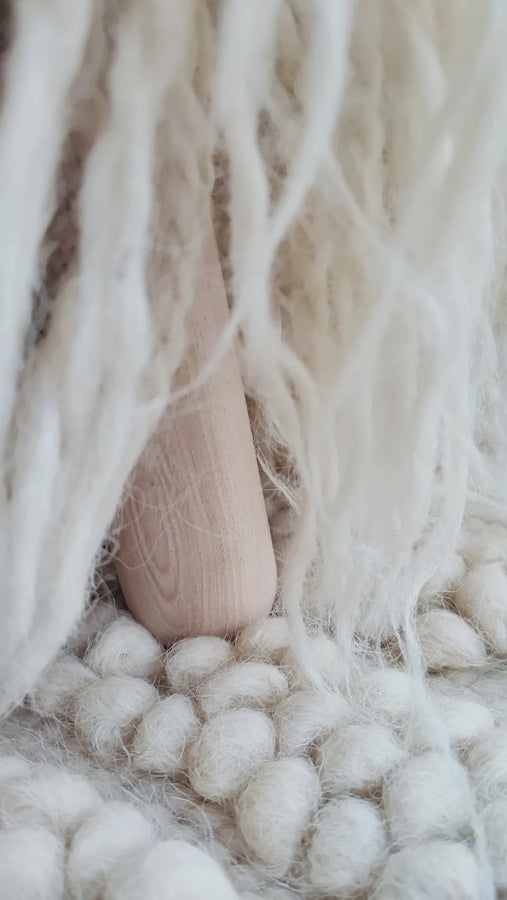 Close-up of Mapico pouf's textured wool surface, handwoven goonya technique detail