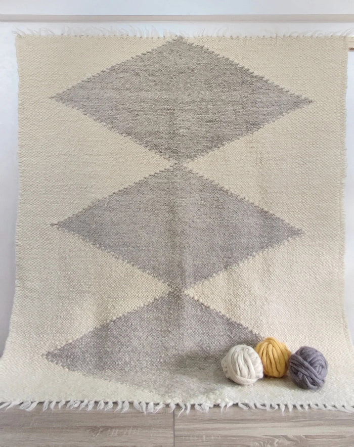 Hand-knotted undyed wool rug, ivory white with large light gray diamond pattern, authentic craftsmanship from Ukraine