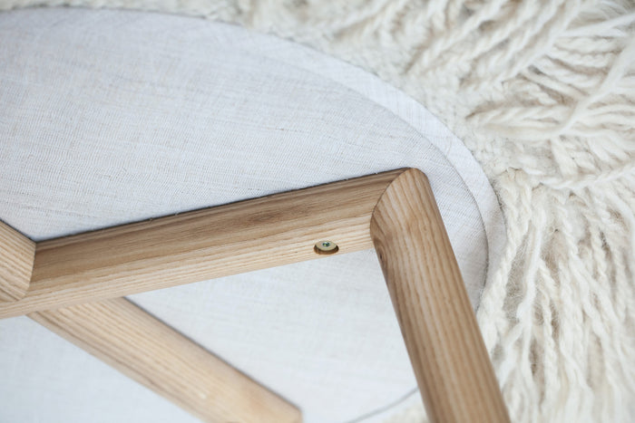 Close-up of handcrafted Mapico chair upholstery and stitching details