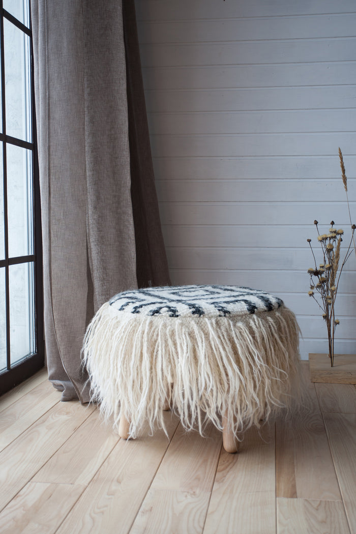 Ethnic pattern black and white Mapico pouf in cozy living space