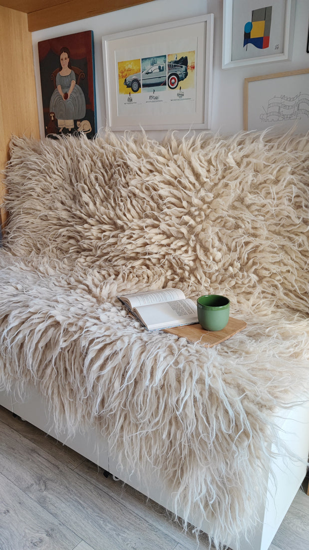 Natural sheep wool flokati rug, available in ivory, light gray, or dark gray, deep tactile shag texture, handcrafted