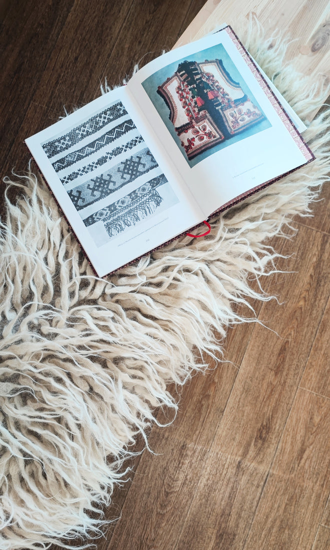 Natural sheep wool flokati rug, available in ivory, light gray, or dark gray, deep tactile shag texture, handcrafted