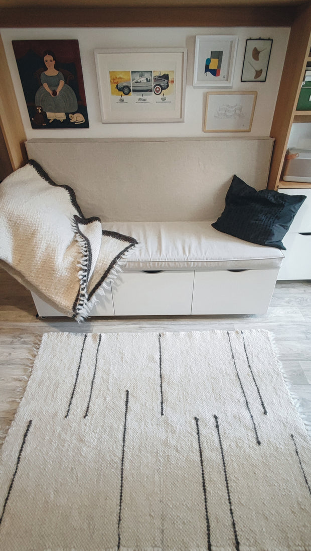 Strypa rug — contemporary minimalist wool rug, ivory and black stripe design, traditional Ukrainian craftsmanship