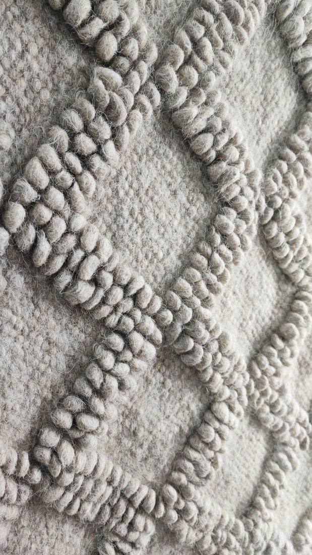 Tern gray rug — minimalist wool rug, sculptural bobble-weave diamonds paired with delicate hand-embroidery, traditional Ukrainian craftsmanship