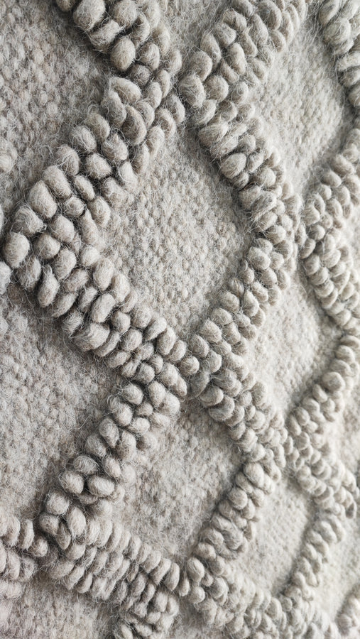 Tern gray rug — minimalist wool rug, sculptural bobble-weave diamonds paired with delicate hand-embroidery, traditional Ukrainian craftsmanship