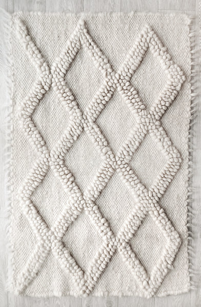 Tern rug — handwoven ivory white wool rug with sculptural diamond texture, modern design from traditional Ukrainian craftsmanship