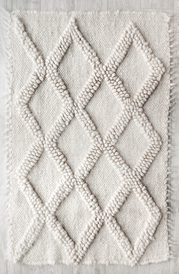 Tern rug — handwoven ivory white wool rug with sculptural diamond texture, modern design from traditional Ukrainian craftsmanship