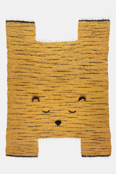 Orange kid's rug in the form of a tiger on white background