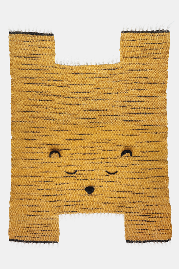 Orange kid's rug in the form of a tiger on white background