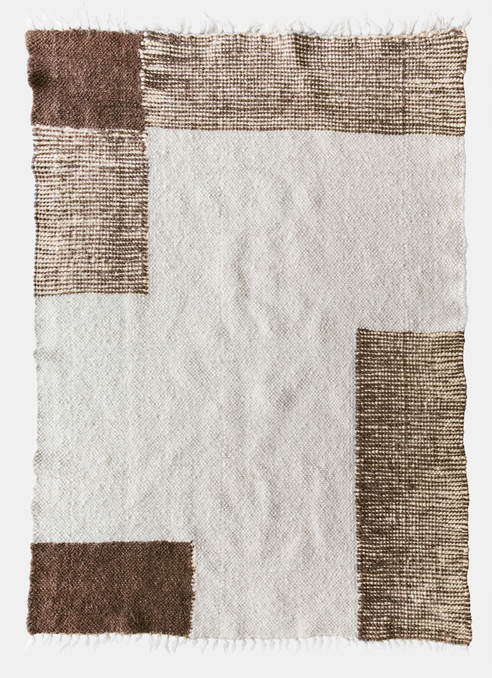 Uday rug — ivory white wool rug with overlapping brown squares, flat-woven using traditional Ukrainian techniques
