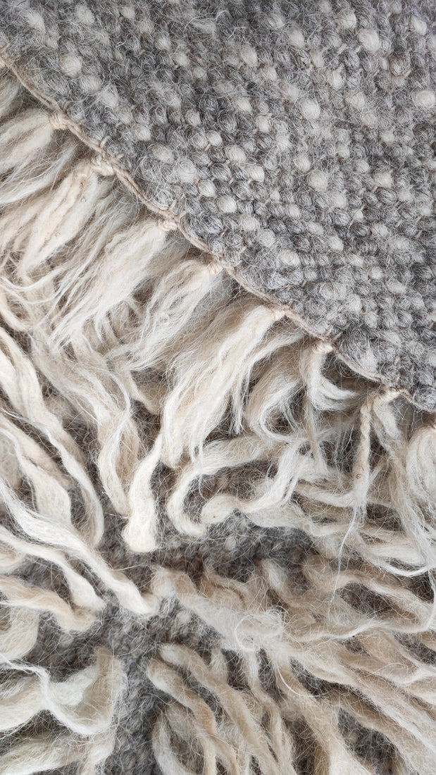 Vovnya rug — fluffy ivory white flokati rug, long-pile wool texture, a cozy minimalist statement for refined interiors