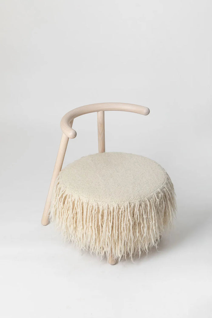 White Mapico accent chair on a minimalist white backdrop