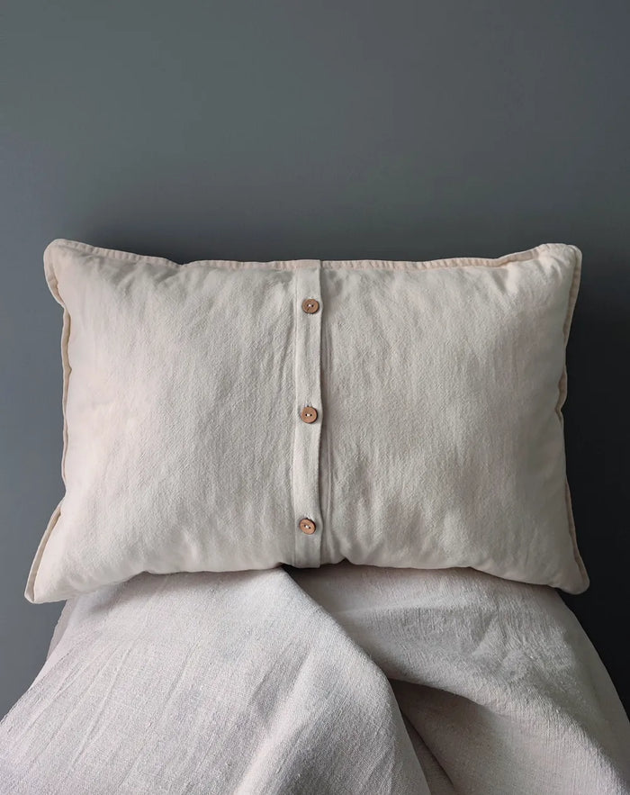 Back view of Mapico linen pillow with natural wooden button fastening, premium cotton-linen fabric