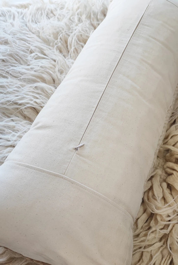 Back side of Murafa lumbar pillow showing cotton twill fabric