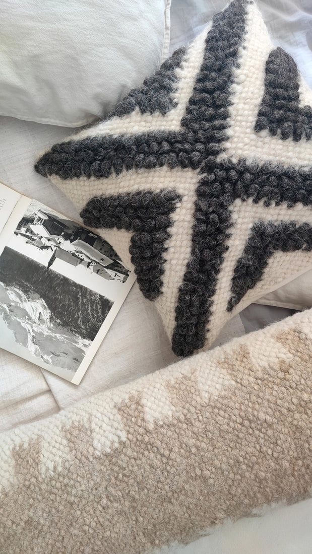 Chaga wool pillow photographed in natural daylight showing wool texture