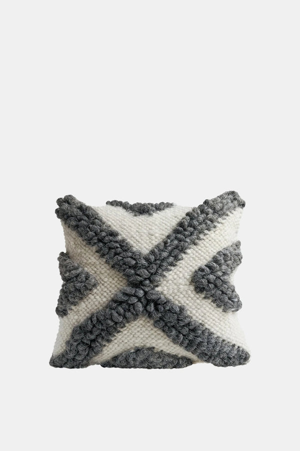 Chaga wool pillow with black and grey bobble pattern on smooth wool base