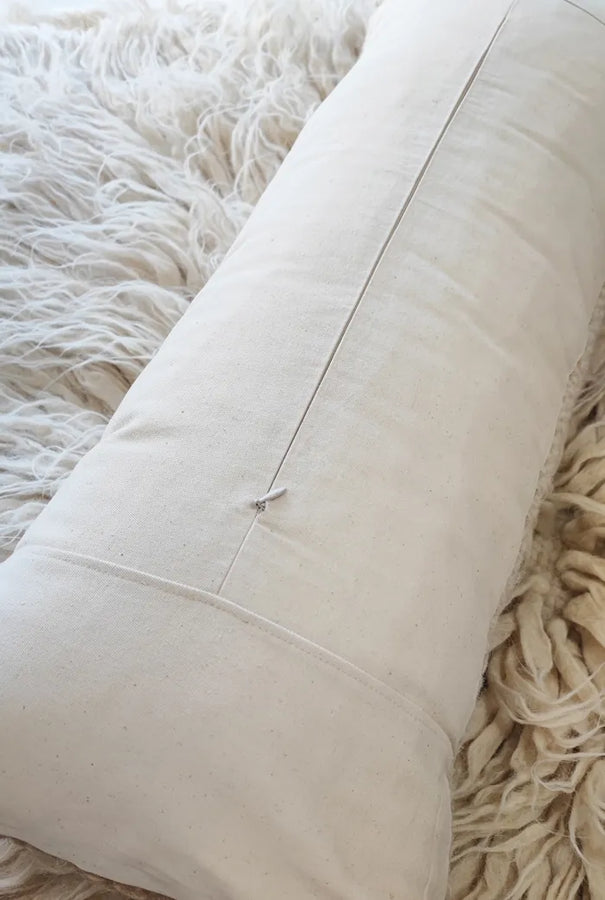 Back view of the woolen pillow Dychyna by MAPICO showing high-quality backing and closure details