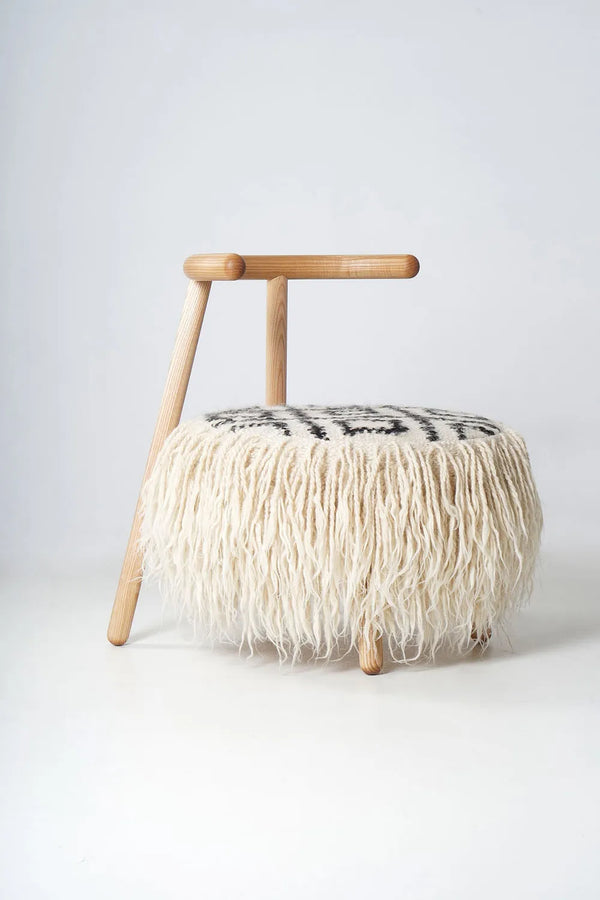 Close-up of the hand-woven black-and-white geometric wool pattern on Mapico chair