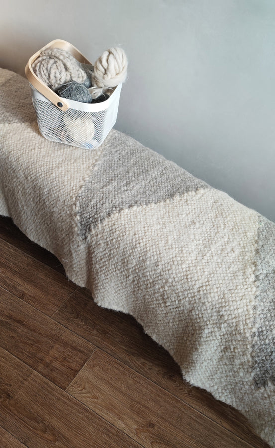 Contemporary wool rug featuring traditional Ukrainian diamond geometry, ivory white and light gray, handcrafted from natural undyed sheep wool