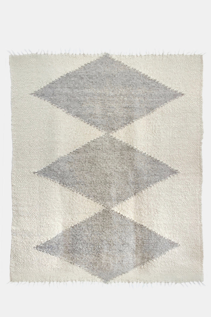 Handmade wool rug in ivory white with light gray diamond pattern, traditional Ukrainian-inspired design