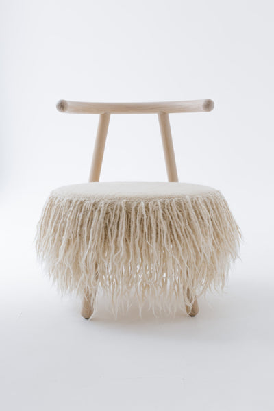 Elegant Mapico armchair displayed against a clean white background