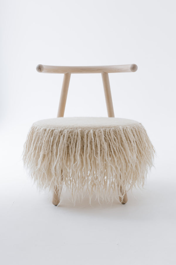Elegant Mapico armchair displayed against a clean white background