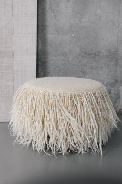 Handcrafted Mapico wool Pouf on the white background