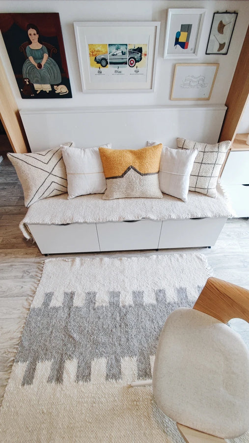 Olava wool pillow shown at 48x48 cm scale for size reference