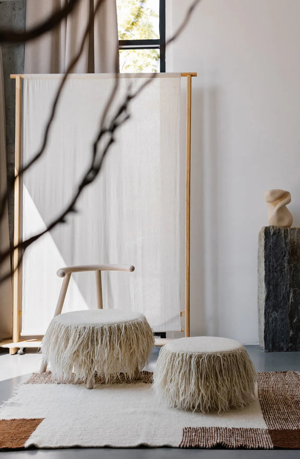 Set of pouf and Mapiko armchair in minimalistic Japandi interior 