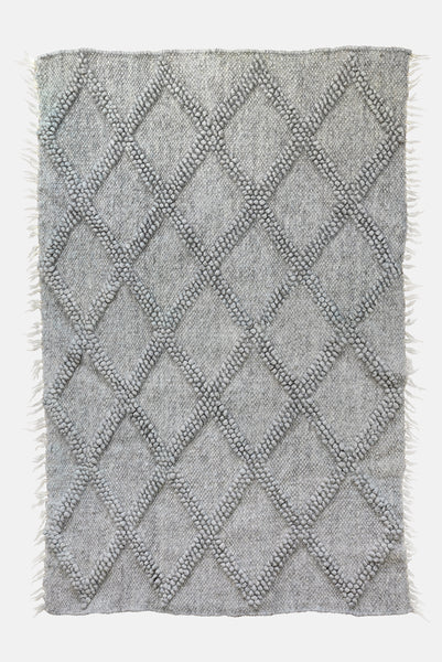Tern grey rug — handwoven wool rug with sculptural big diamond bobble texture and contrasting hand-embroidered diamond accents