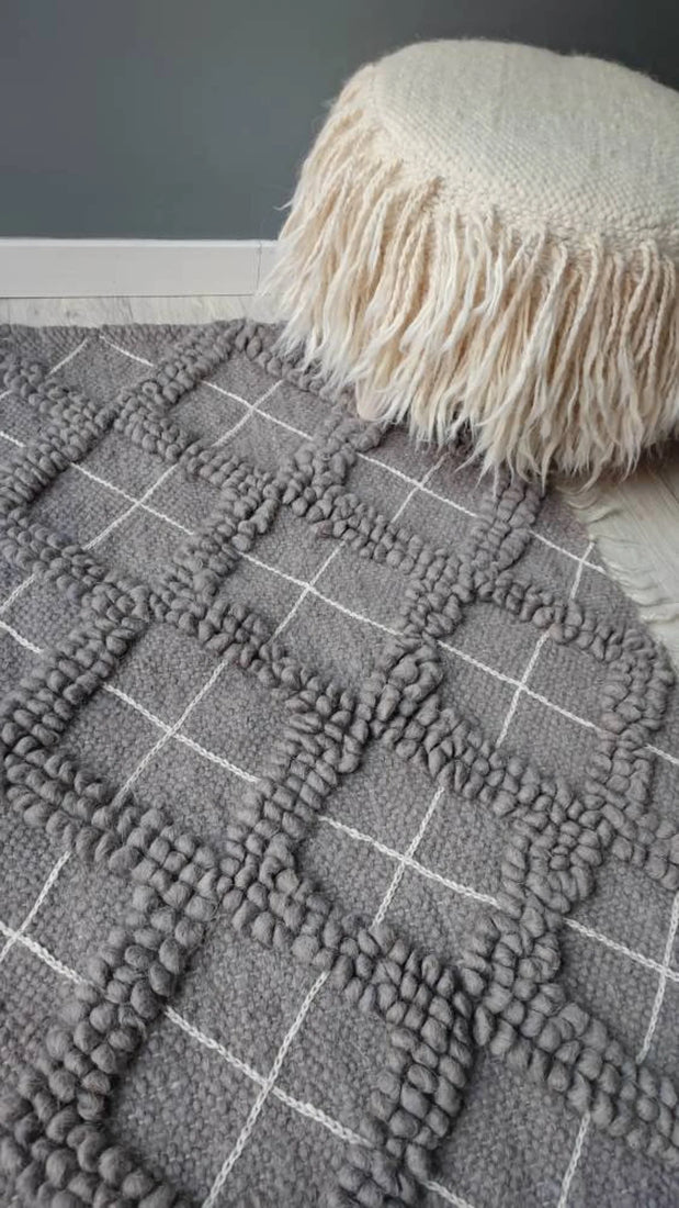 Sula rug — minimalist ivory-on-ivory wool rug, sculptural bobble-weave diamonds paired with delicate hand-embroidery, traditional Ukrainian craftsmanship