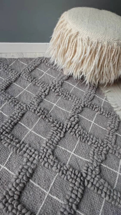 Sula rug — minimalist ivory-on-ivory wool rug, sculptural bobble-weave diamonds paired with delicate hand-embroidery, traditional Ukrainian craftsmanship