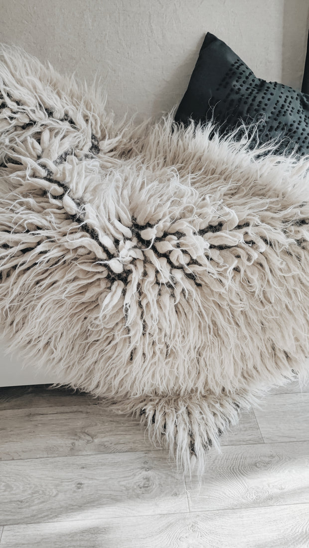Natural undyed flokati shag rug, light gray tone, ultra-soft long-pile wool, handcrafted using traditional techniques