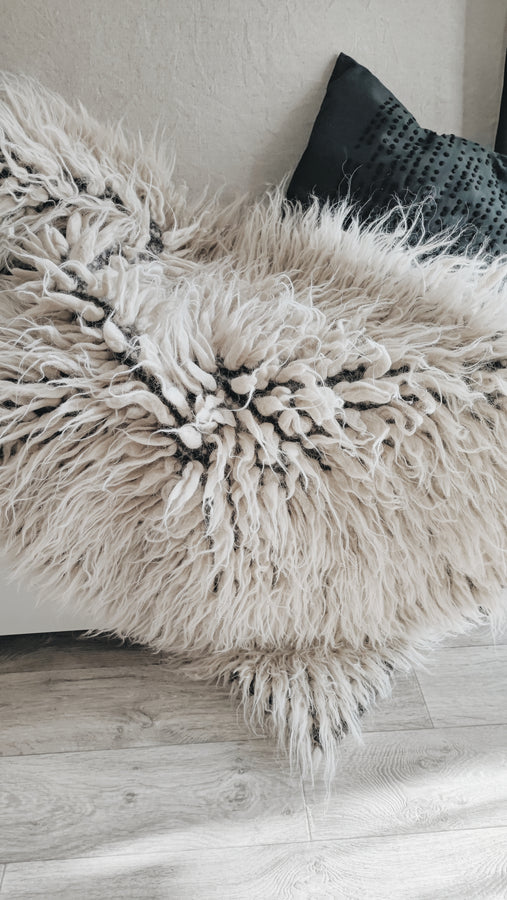 Natural undyed flokati shag rug, light gray tone, ultra-soft long-pile wool, handcrafted using traditional techniques