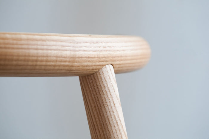 Detail view of Mapico chair’s wooden legs