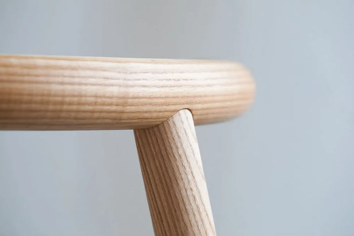 Detail view of Mapico chair’s wooden legs